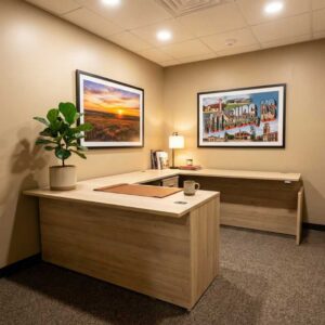 U shaped executive desk in light wood laminate installed in a private office with floor to ceiling cubicle walls in Pittsburg Kansas by Green Clean Designs