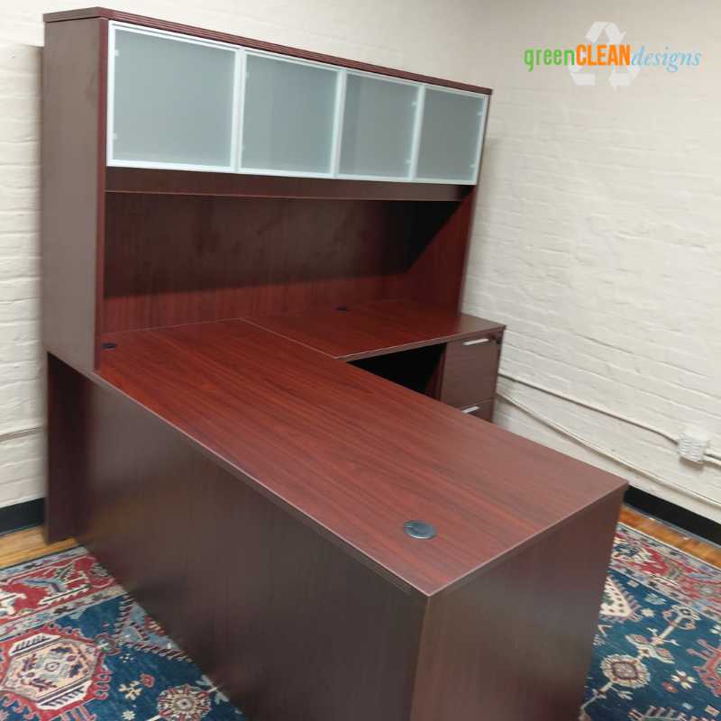 Mahogany L-shaped desk with frosted glass hutch doors installed in a Chicago law office by Green Clean Designs, replacing discontinued Mayline casegoods